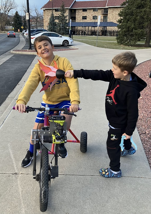 Sharing the bike with cousins 2